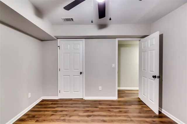a view of yard with swimming pool and trees in the background
