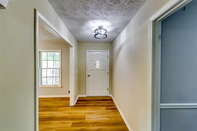 a view of entryway with wooden floor