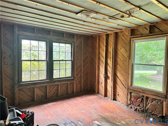 a view of a room with furniture and a window