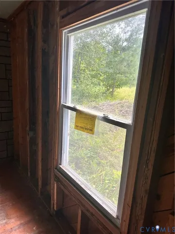 a view of a room with a large window