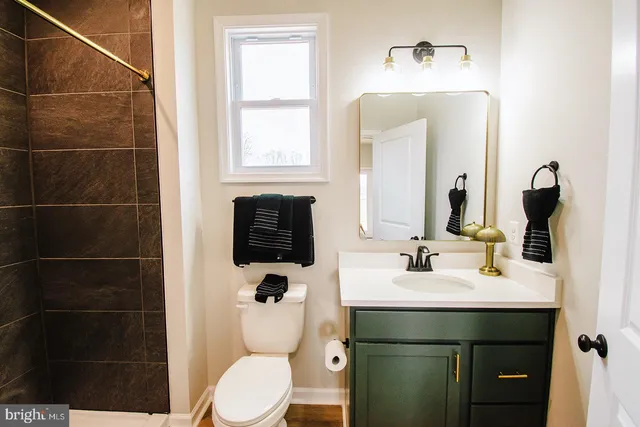 a bathroom with a shower curtain and a sink