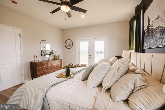 a living room with furniture and a dining table with kitchen view