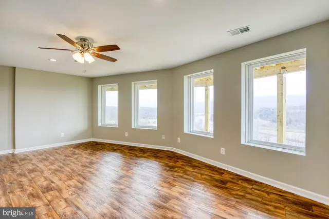 a view of a balcony with a white wall