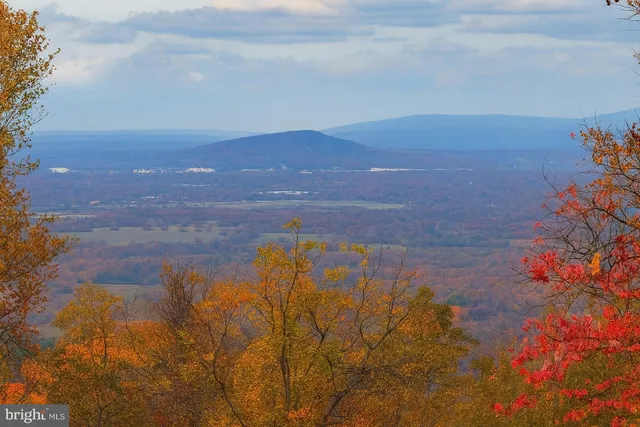 a view of lake with mountain in the back