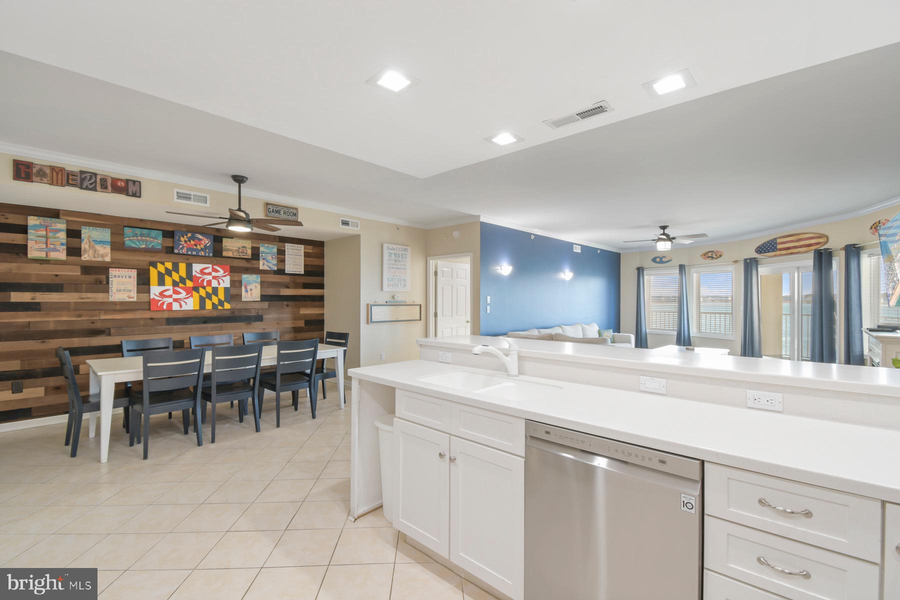 310 2nd Street, Unit 101 Ocean City, MD 21842 - Photo 11 of 37 a view of a kitchen and dining room