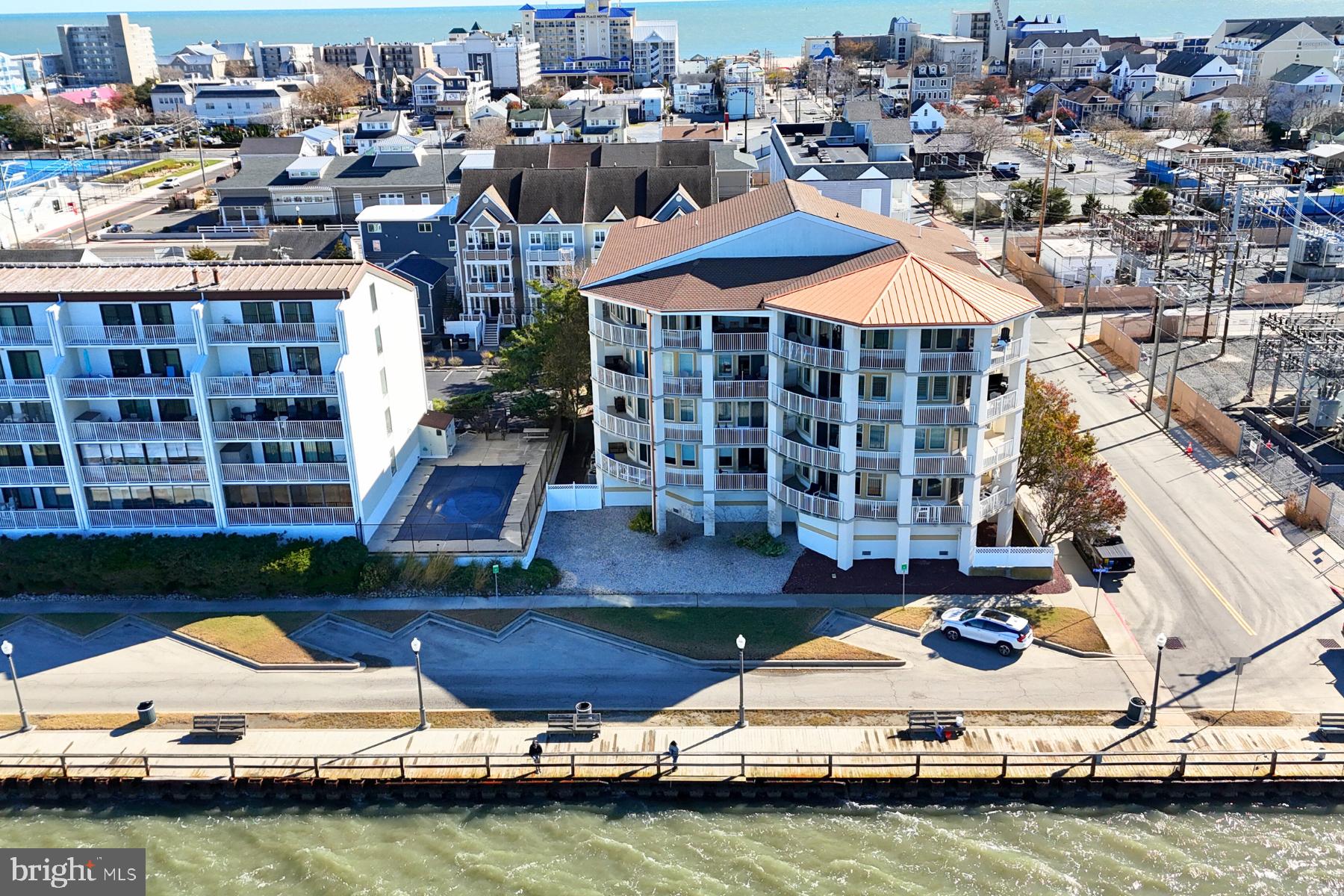 310 2nd Street, Unit 101 Ocean City, MD 21842 - Photo 2 of 37 a view of swimming pool with outdoor seating and yard
