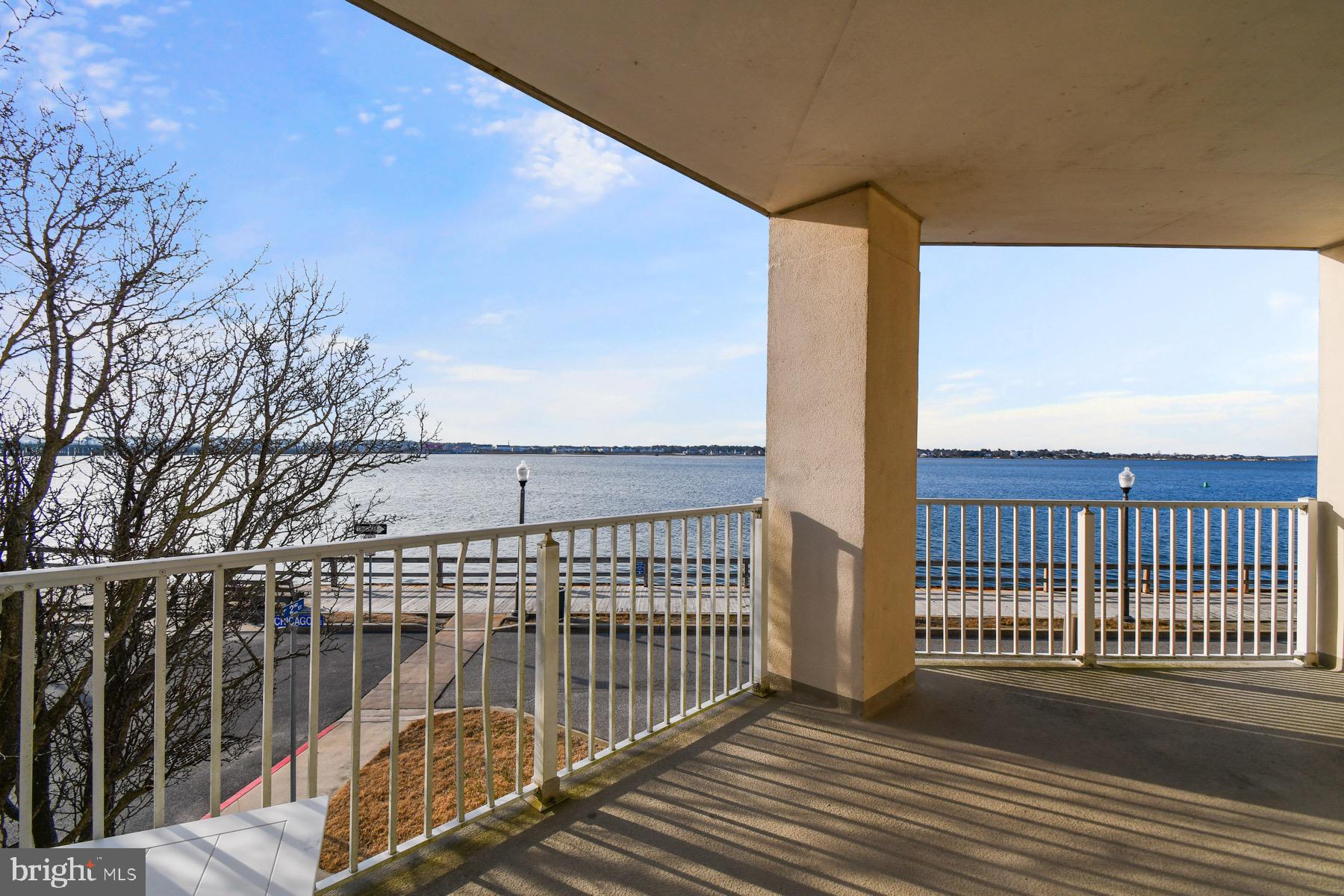 310 2nd Street, Unit 101 Ocean City, MD 21842 - Photo 30 of 37 a view of balcony with wooden floor