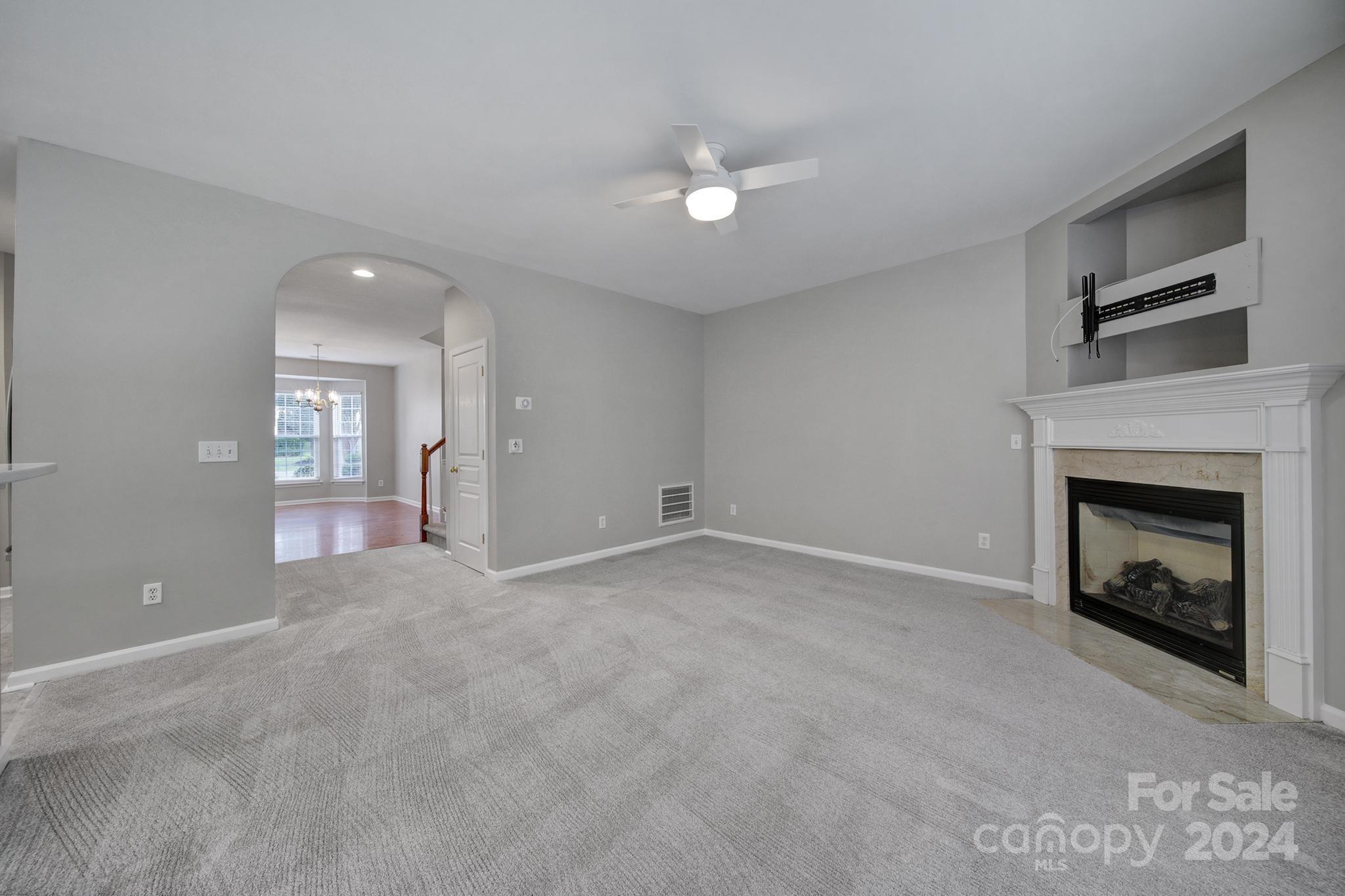 3305 Adair Marble Street Fort Mill, SC 29708 - Photo 13 of 38 a view of empty room with window and fireplace