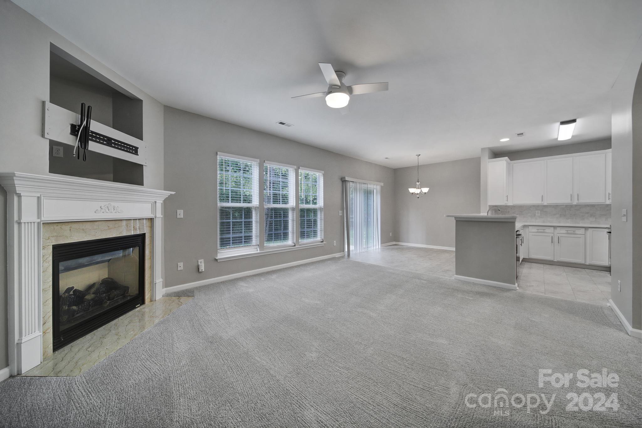 3305 Adair Marble Street Fort Mill, SC 29708 - Photo 14 of 38 a view of a livingroom with a fireplace and cabinet