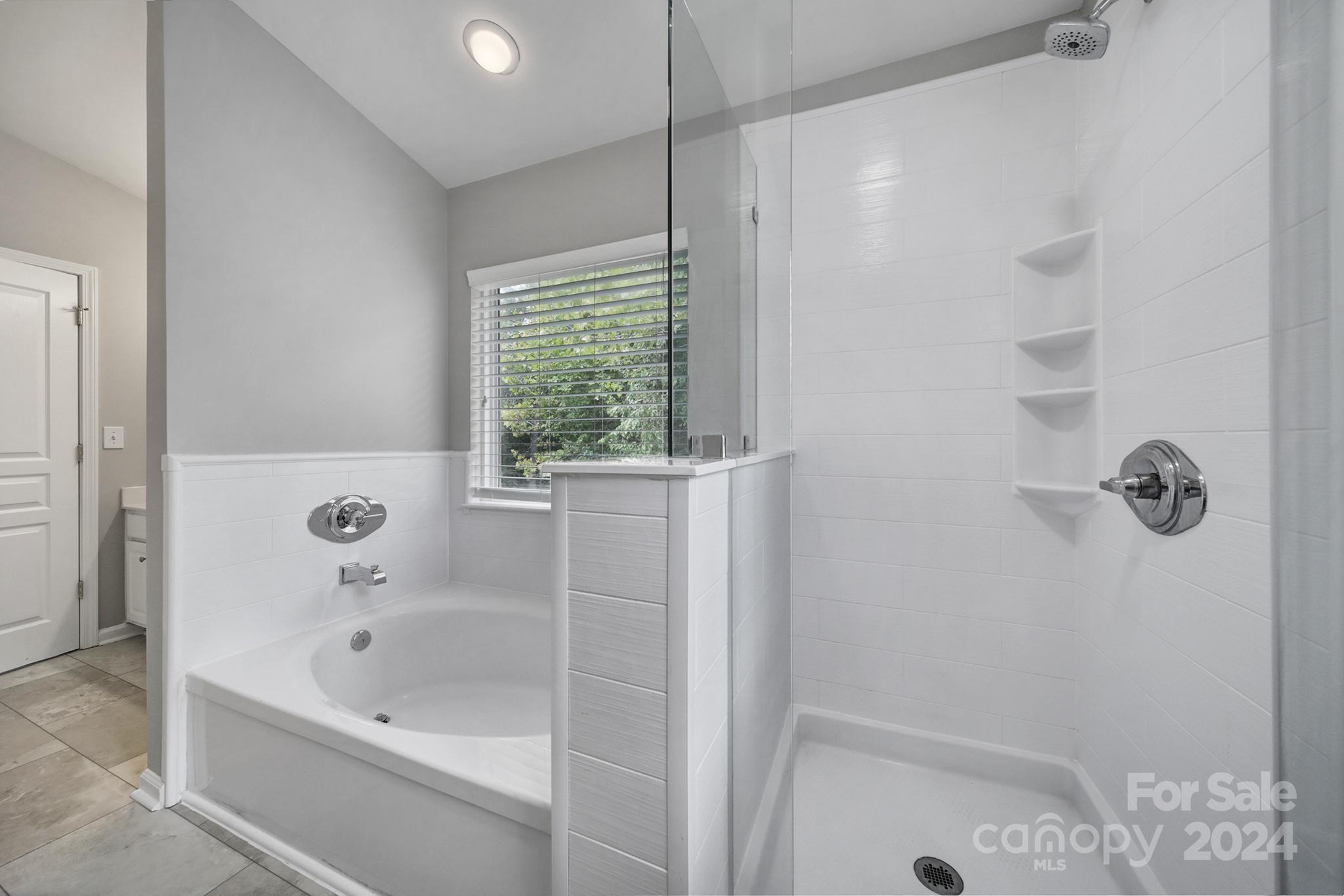 3305 Adair Marble Street Fort Mill, SC 29708 - Photo 20 of 38 a bathroom with a bathtub