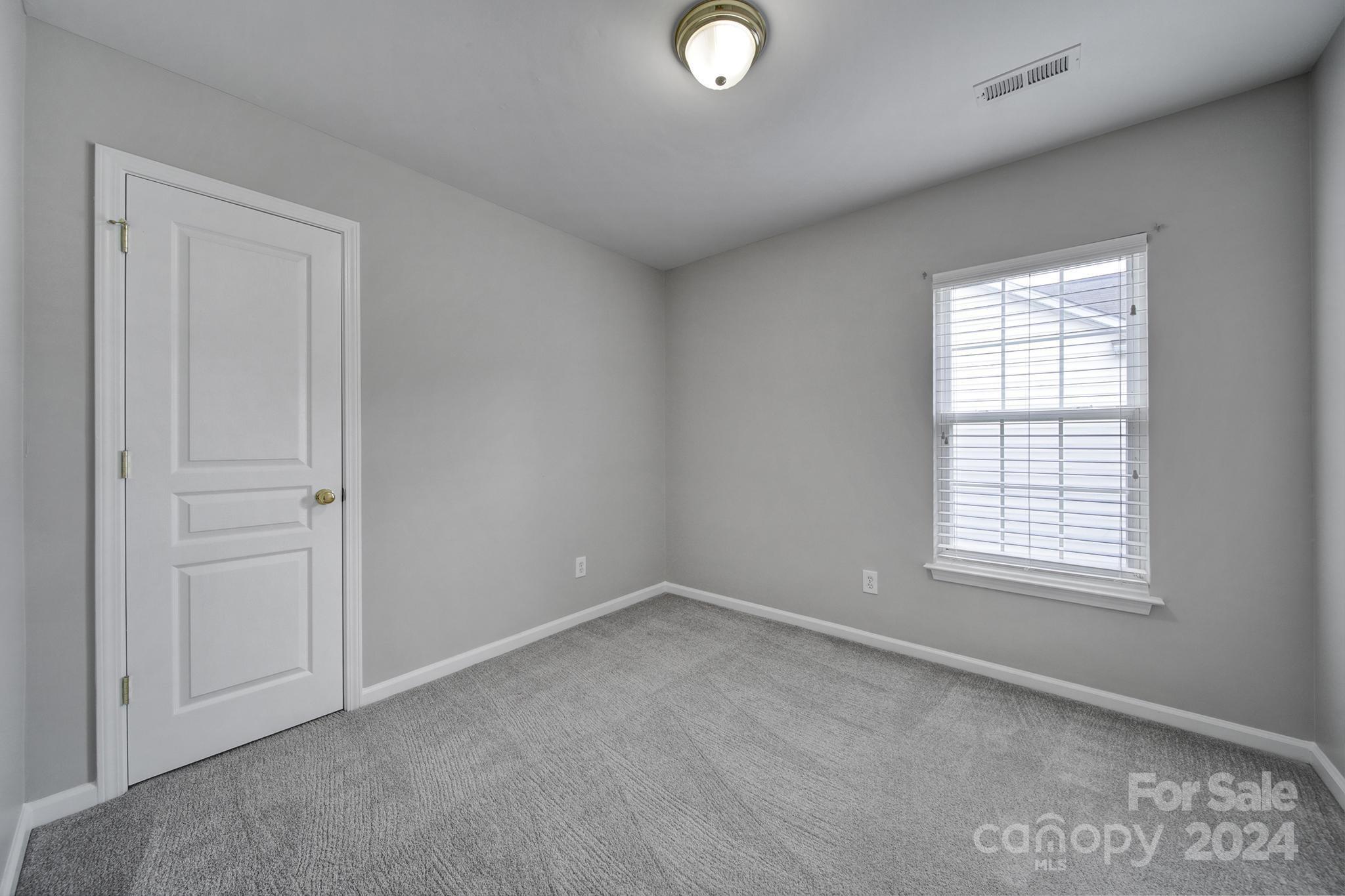 3305 Adair Marble Street Fort Mill, SC 29708 - Photo 21 of 38 an empty room with windows