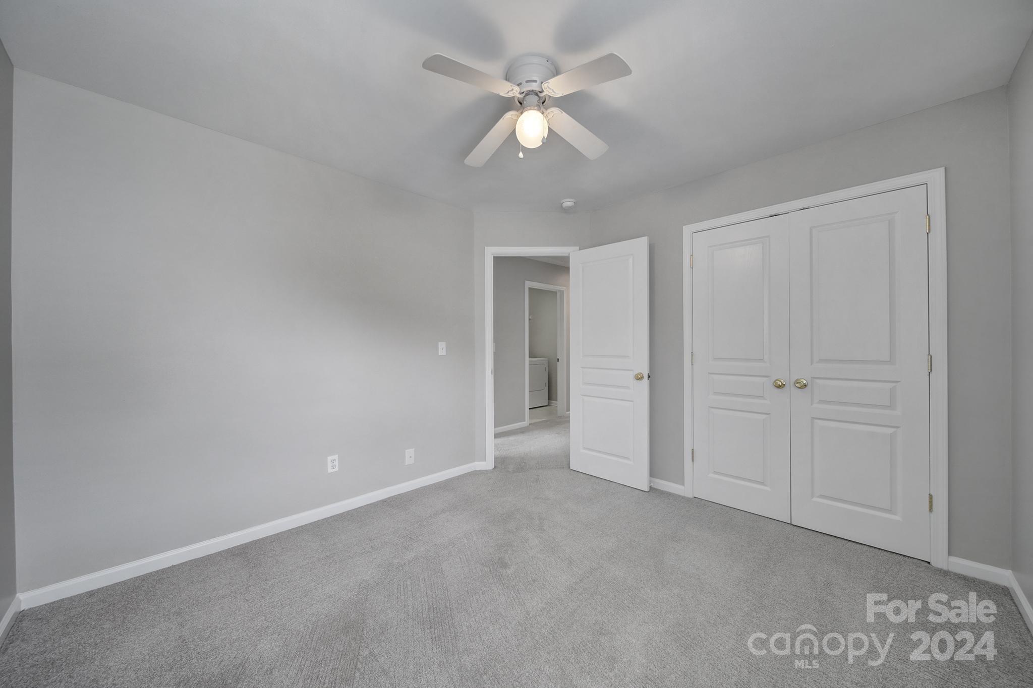 3305 Adair Marble Street Fort Mill, SC 29708 - Photo 28 of 38 an empty room with a ceiling fan and a ceiling fan