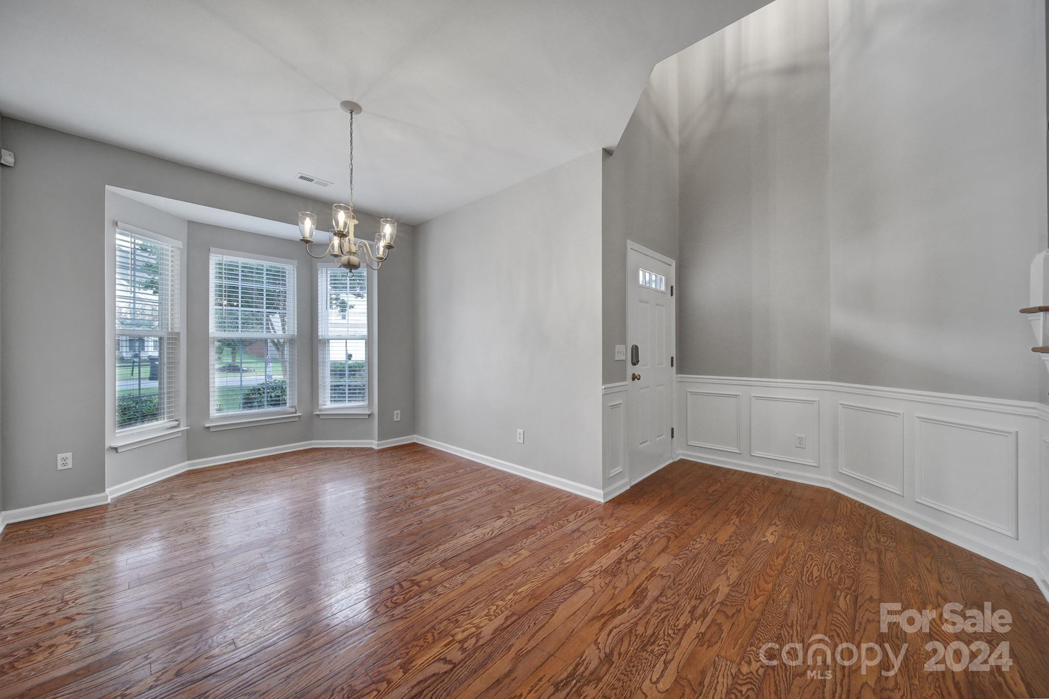 3305 Adair Marble Street Fort Mill, SC 29708 - Photo 4 of 38 wooden floor in an empty room with a window