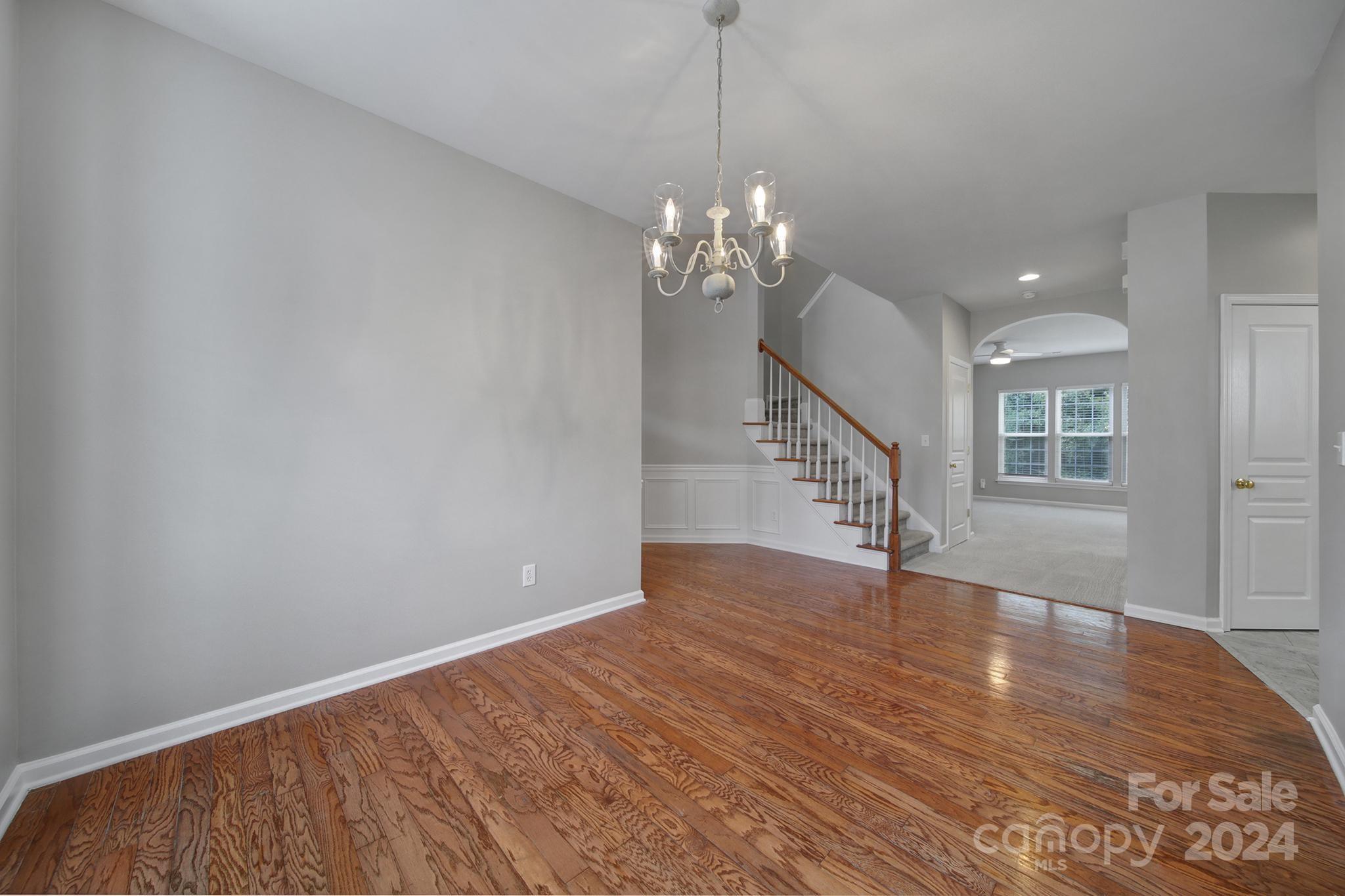 3305 Adair Marble Street Fort Mill, SC 29708 - Photo 5 of 38 a view of a room with wooden floor and staircase