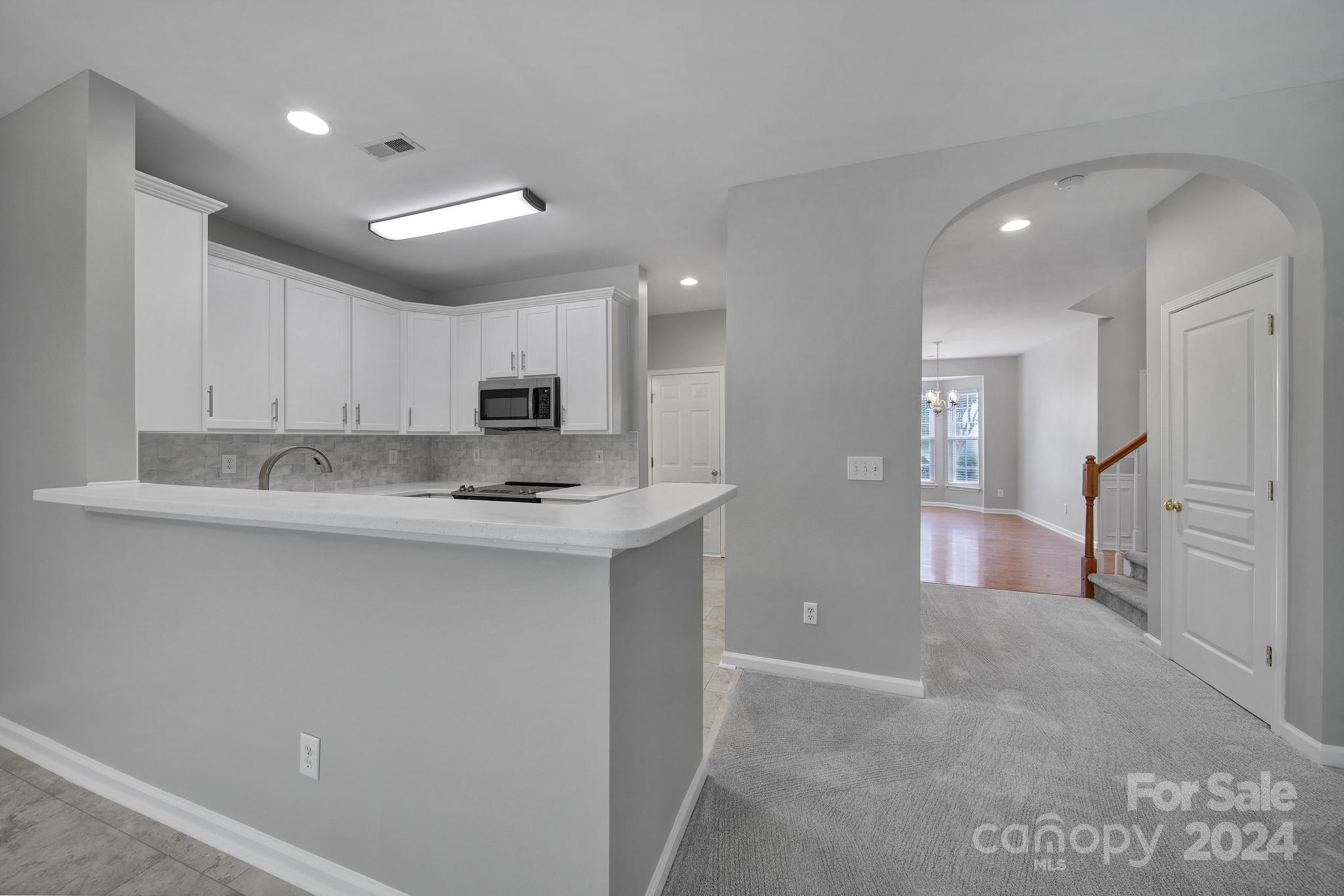 3305 Adair Marble Street Fort Mill, SC 29708 - Photo 7 of 38 a large kitchen with stainless steel appliances granite countertop a sink and cabinets