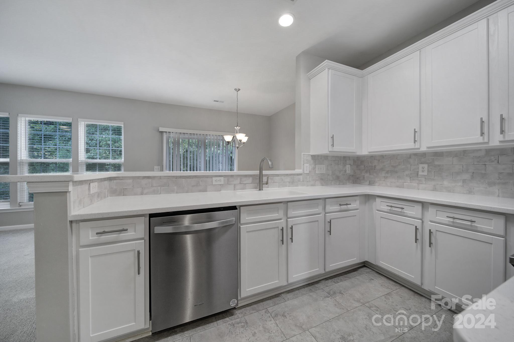 3305 Adair Marble Street Fort Mill, SC 29708 - Photo 8 of 38 a kitchen with a sink and cabinets