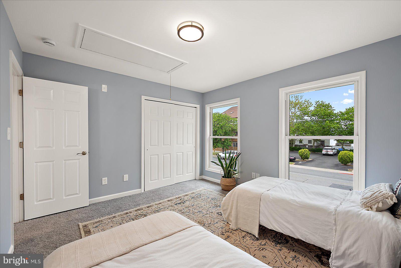 135 Jamestown Road, Unit 18A Ocean City, MD 21842 - Photo 35 of 63 a bedroom with a bed and a large window
