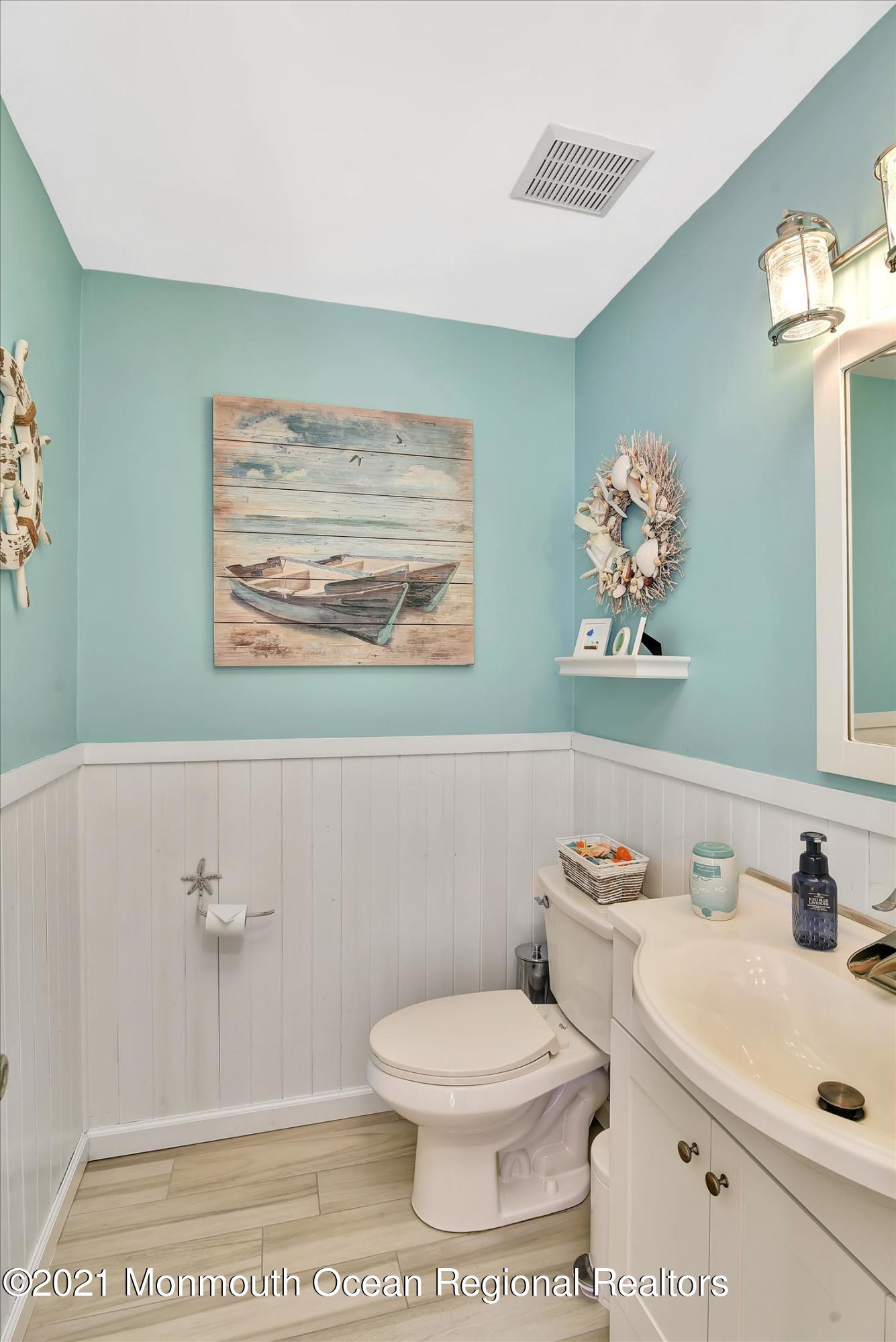 63 Hedgewood Road Howell, NJ 07731 - Photo 12 of 25 a bathroom with a sink a toilet and a mirror