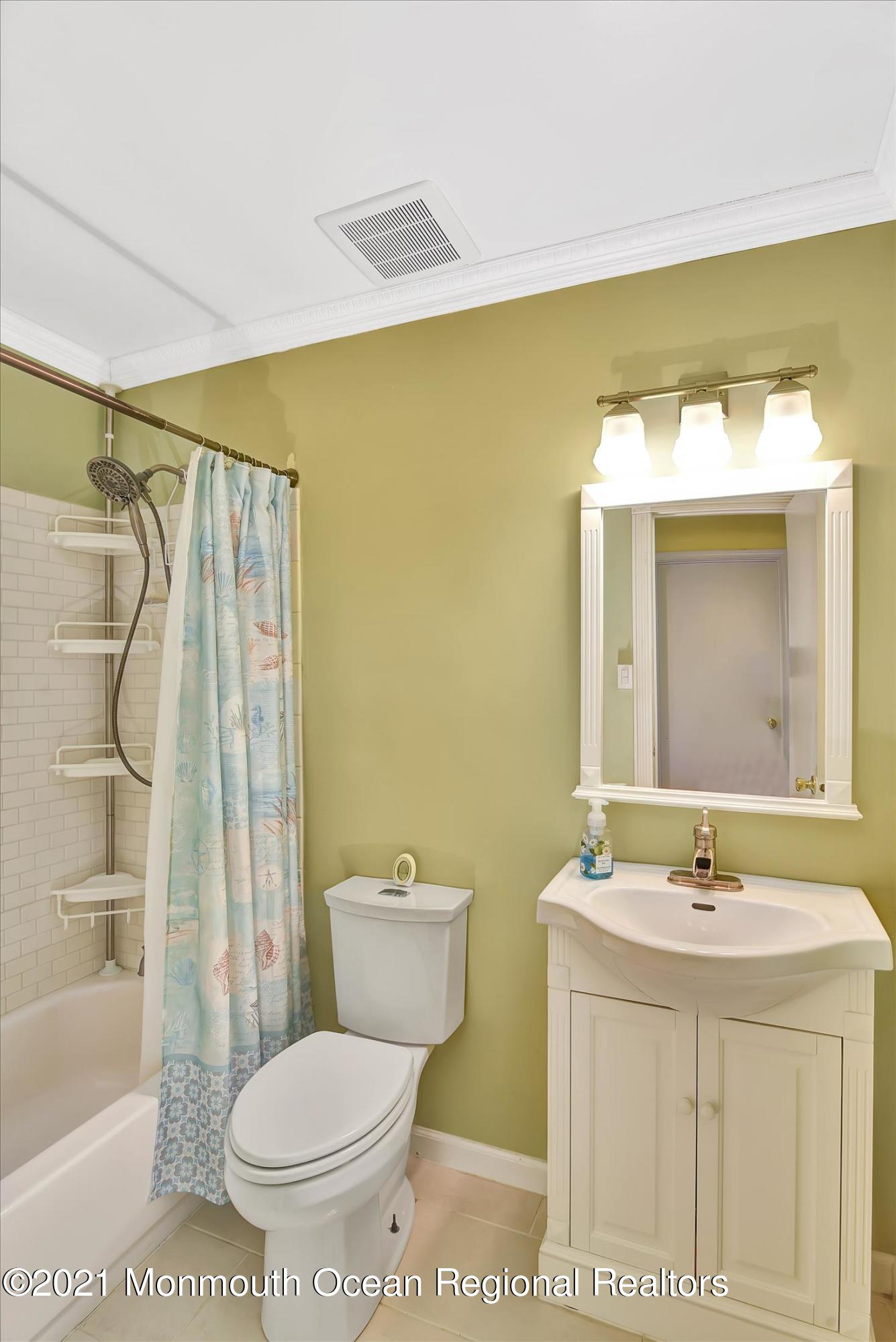63 Hedgewood Road Howell, NJ 07731 - Photo 17 of 25 a bathroom with a sink mirror vanity and toilet