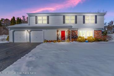 63 Hedgewood Road Howell, NJ 07731 - Photo 25 of 25 a view of a house with a yard and garage