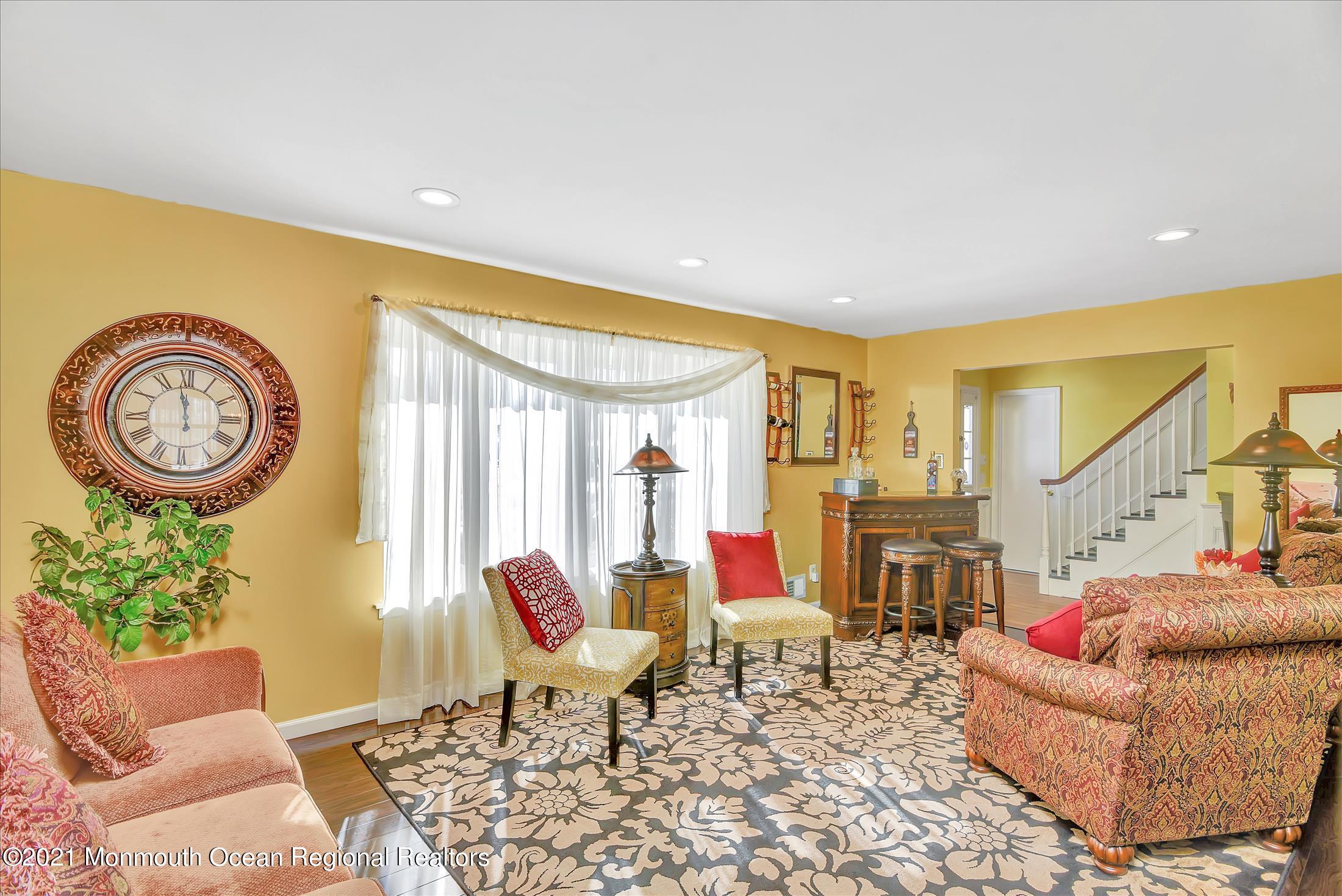 63 Hedgewood Road Howell, NJ 07731 - Photo 4 of 25 a living room with furniture and a large window
