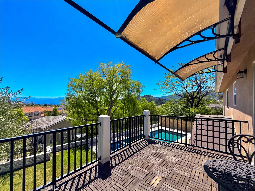 25714 Wallace Place Stevenson Ranch, CA 91381 - Photo 16 of 24 a view of a balcony with wooden floor