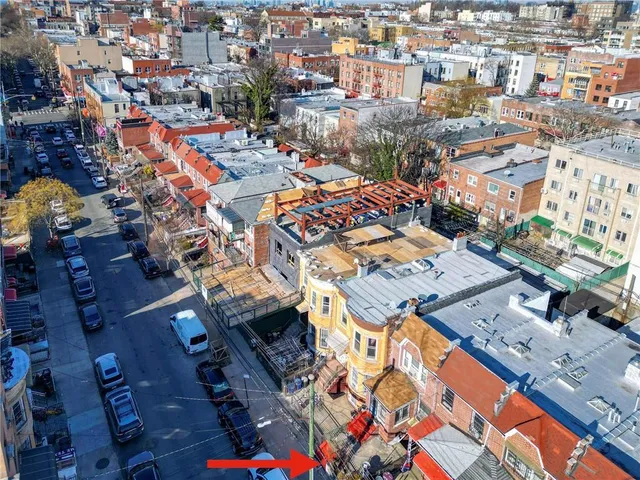 an aerial view of a city with lots of residential buildings