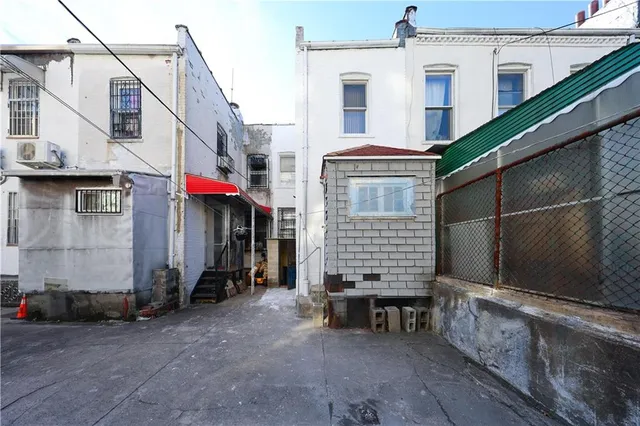 a view of a house with a wooden deck
