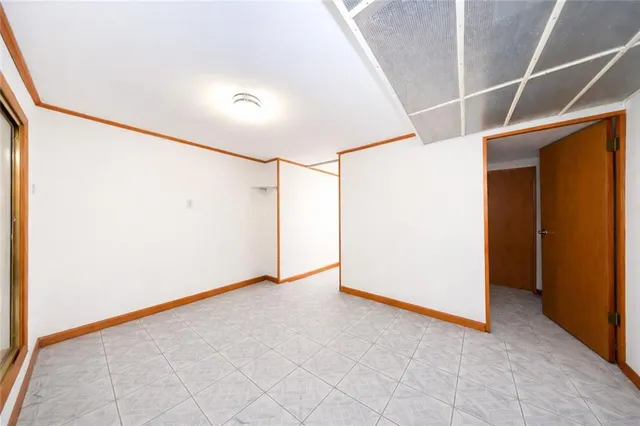 a living room with furniture and a piano