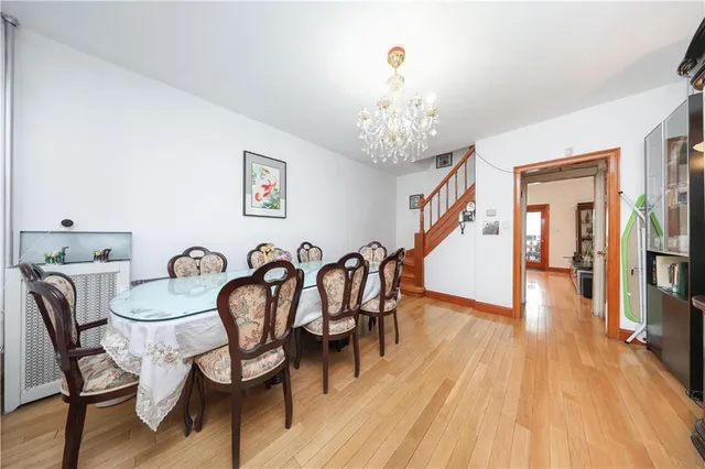 a kitchen with a sink cabinets and wooden floor