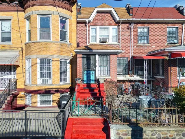 a front view of a house with outdoor seating