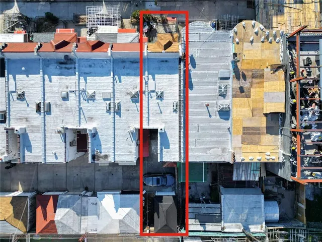 a front view of a building with retail shops