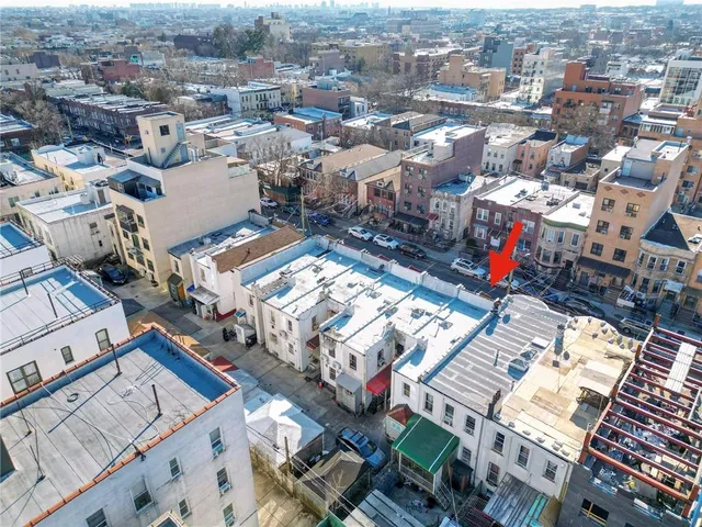 an aerial view of a city with lots of residential buildings
