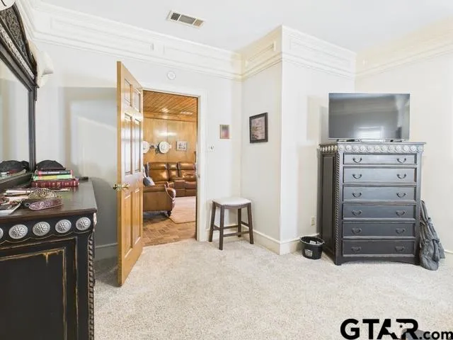a view of room with furniture and flat screen tv