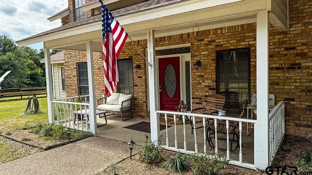 a view of a swimming pool with seating space
