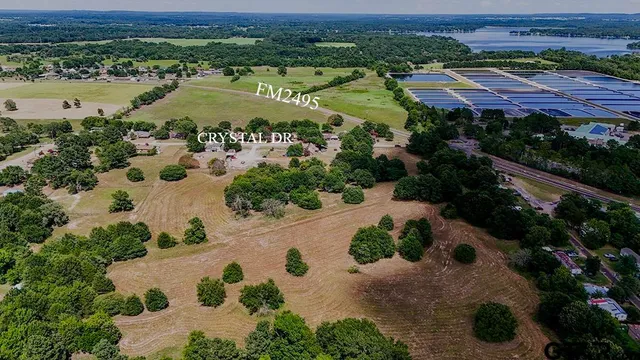 an aerial view of a house with garden space and street view