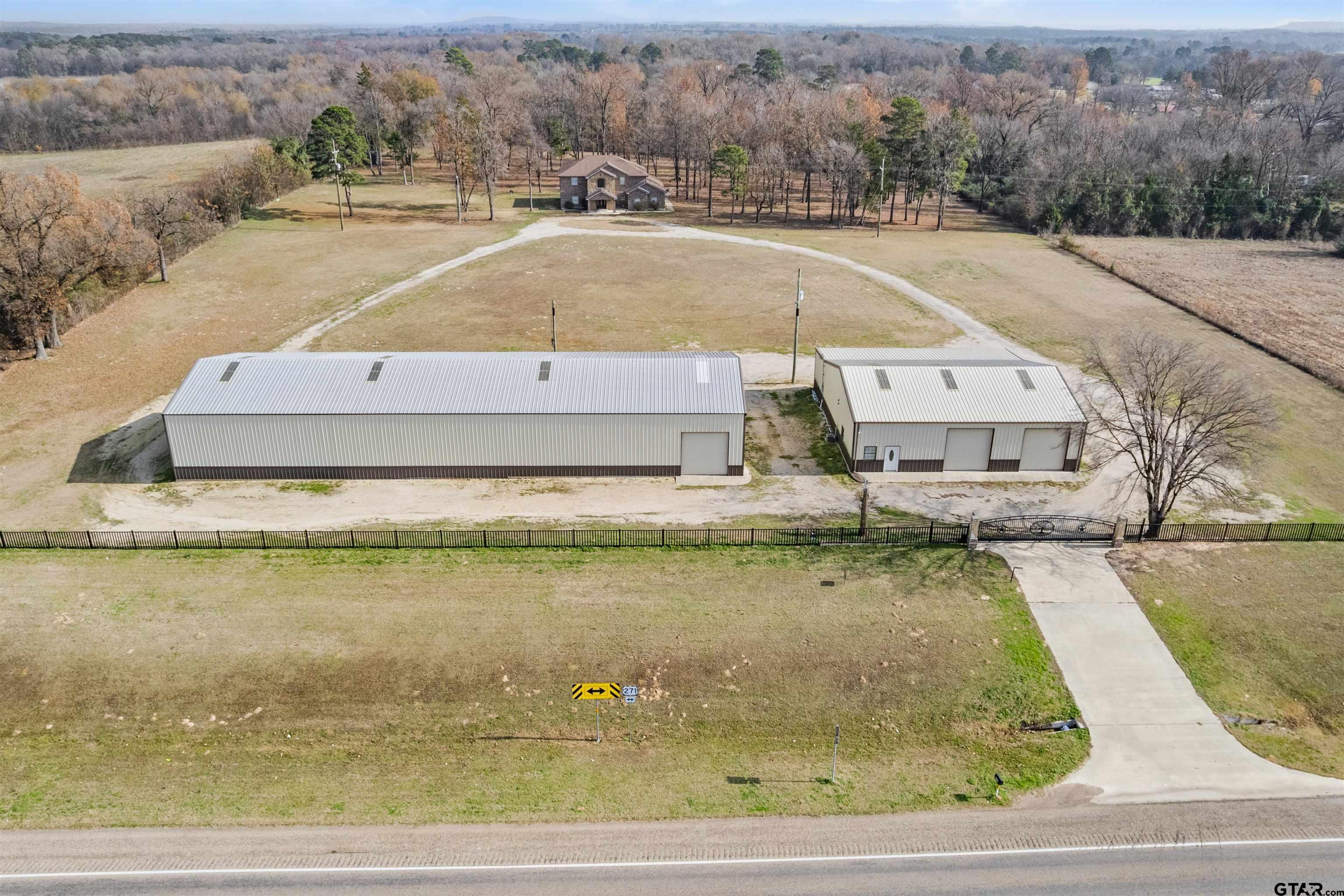5796 Highway 271 Pittsburg, TX 75686 - Photo 2 of 43 an aerial view of residential houses with outdoor space