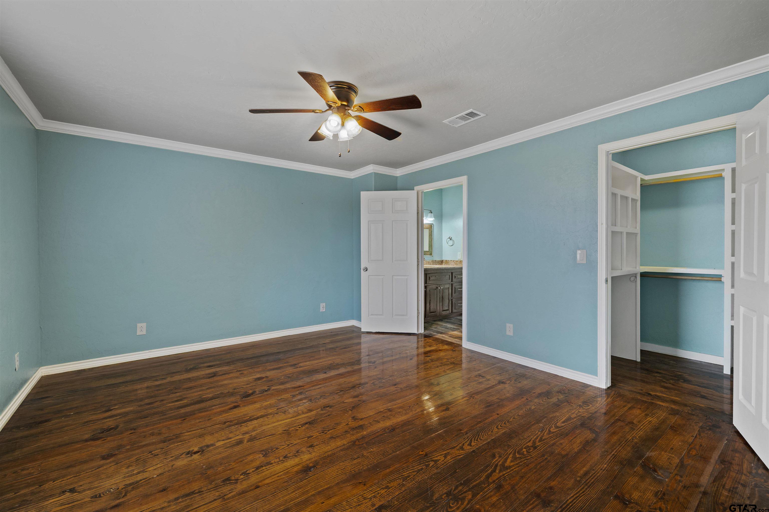 5796 Highway 271 Pittsburg, TX 75686 - Photo 24 of 43 a view of an empty room with wooden floor