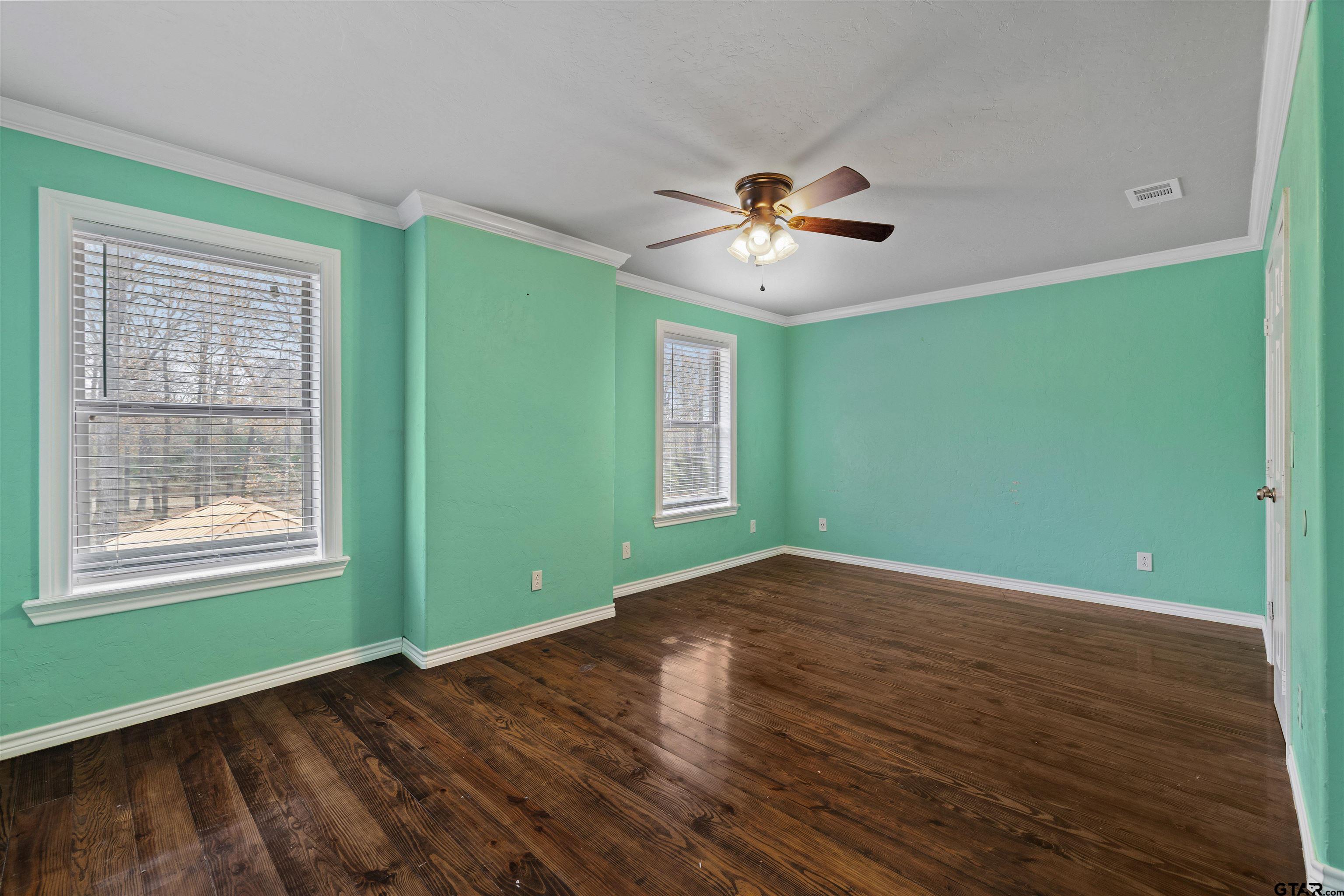 5796 Highway 271 Pittsburg, TX 75686 - Photo 31 of 43 a view of an empty room with window and wooden floor