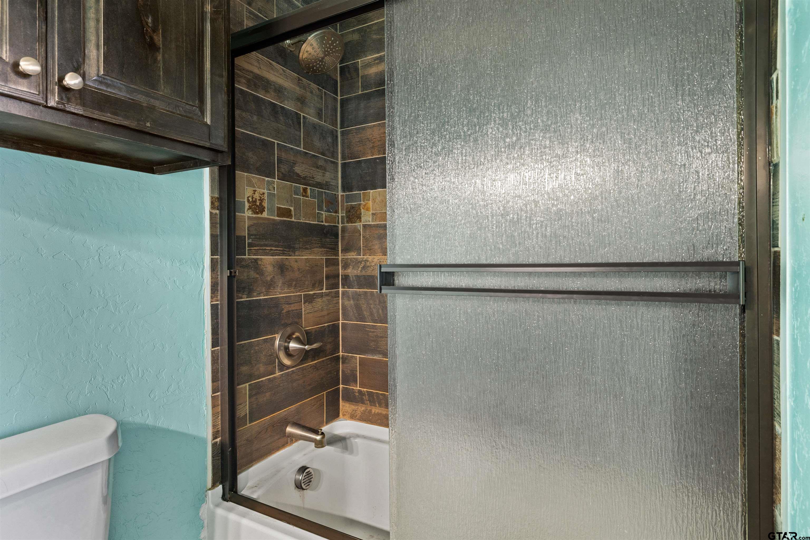 5796 Highway 271 Pittsburg, TX 75686 - Photo 32 of 43 a bathroom with a shower