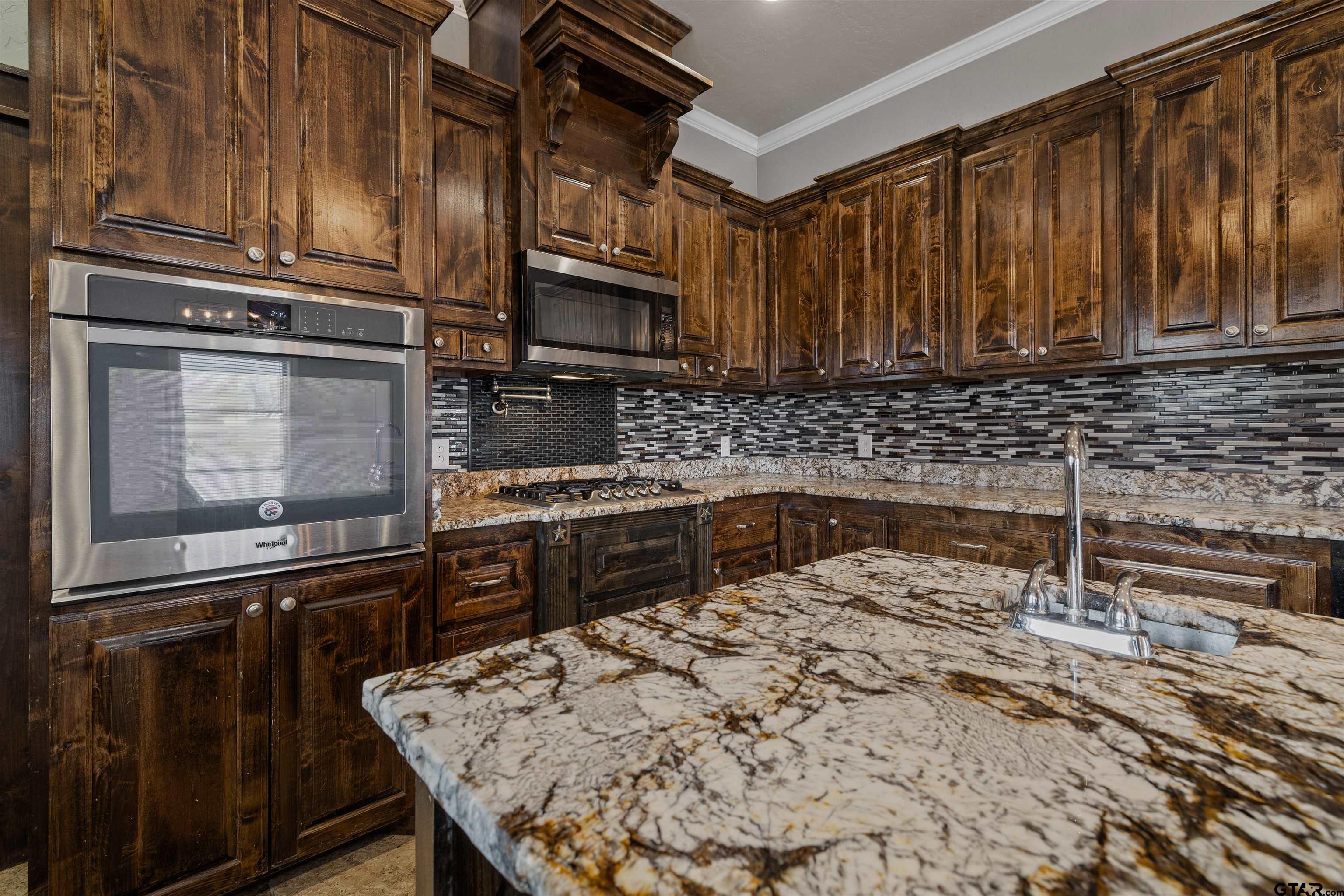 5796 Highway 271 Pittsburg, TX 75686 - Photo 8 of 43 a kitchen with a refrigerator stove and sink