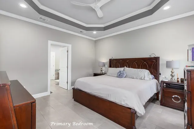 a bedroom with a bed and a tv