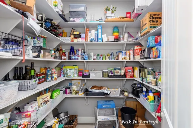a room with lots of furniture and a baby bed