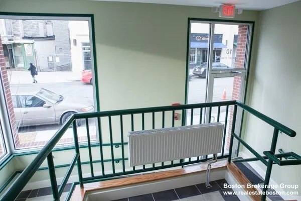 a view of staircase with a rug