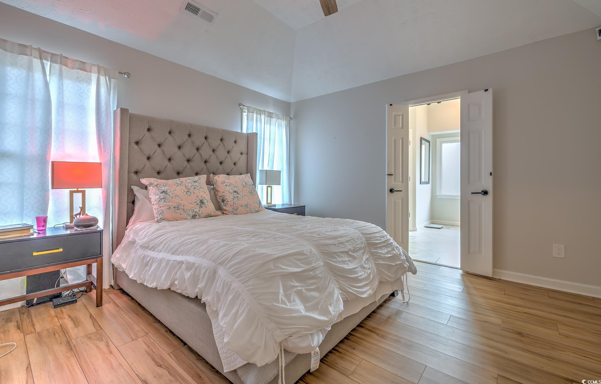 603 Hatteras River Road Myrtle Beach, SC 29588 - Photo 12 of 22 Bedroom with light wood-type flooring and ceiling