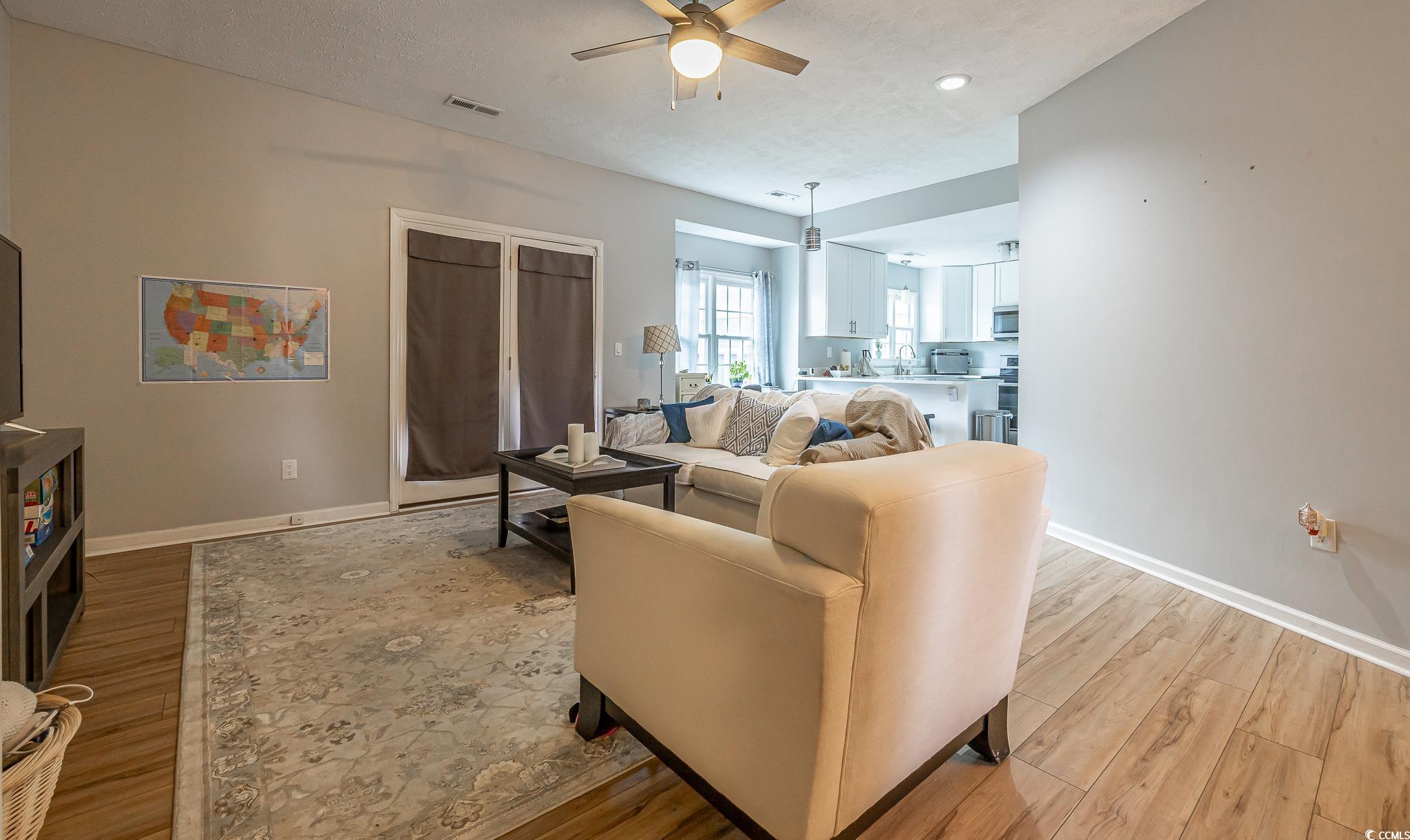 603 Hatteras River Road Myrtle Beach, SC 29588 - Photo 13 of 22 Living room featuring light hardwood / wood-style