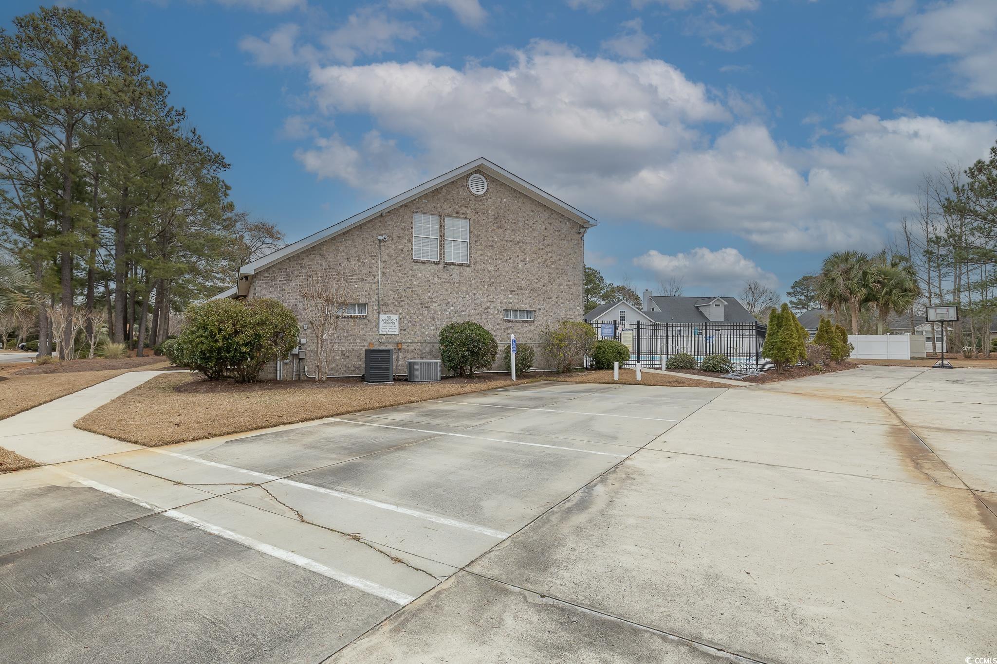 603 Hatteras River Road Myrtle Beach, SC 29588 - Photo 21 of 22 View of property exterior featuring central AC uni