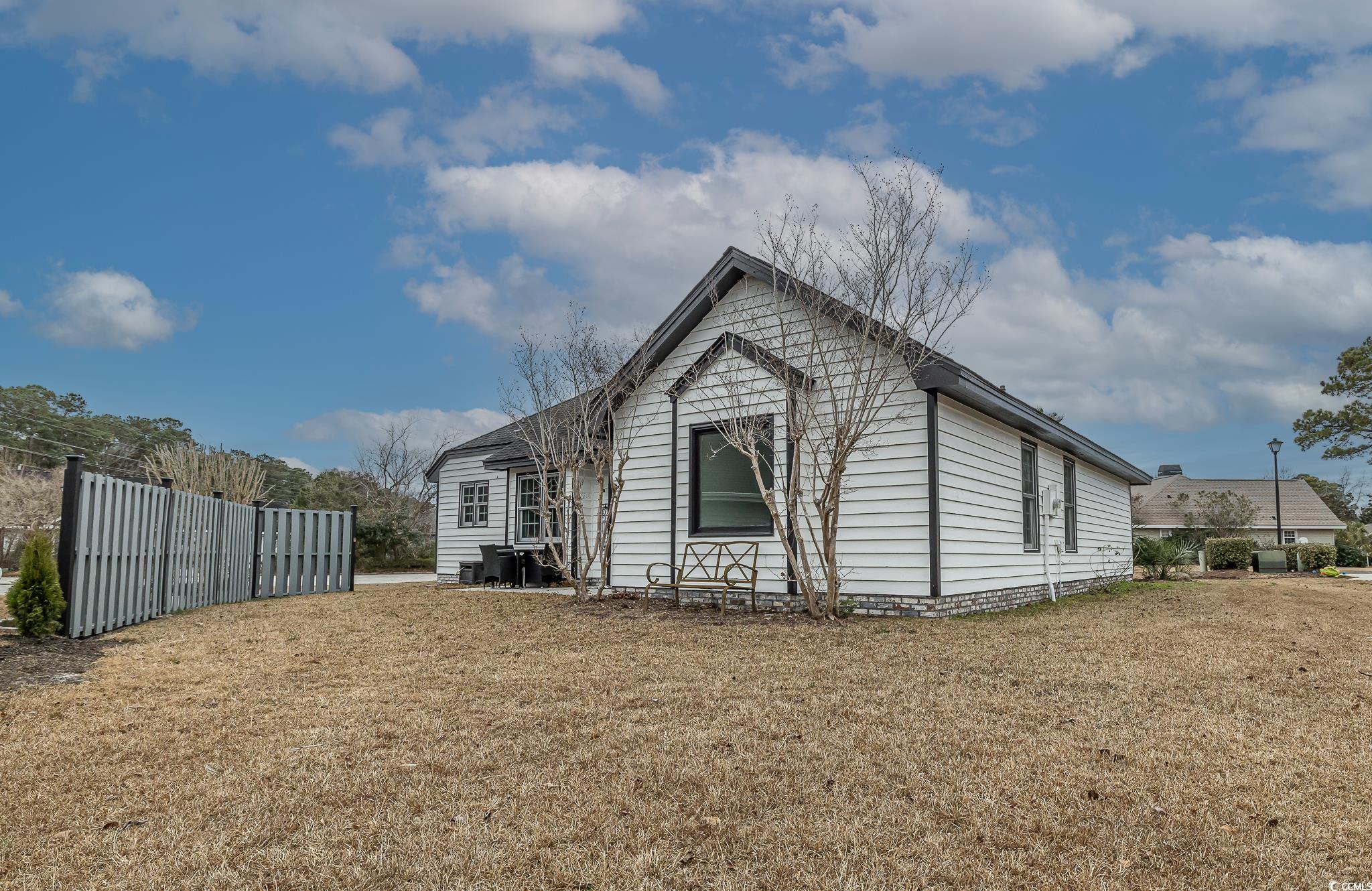 603 Hatteras River Road Myrtle Beach, SC 29588 - Photo 5 of 22 View of side of home with a lawn