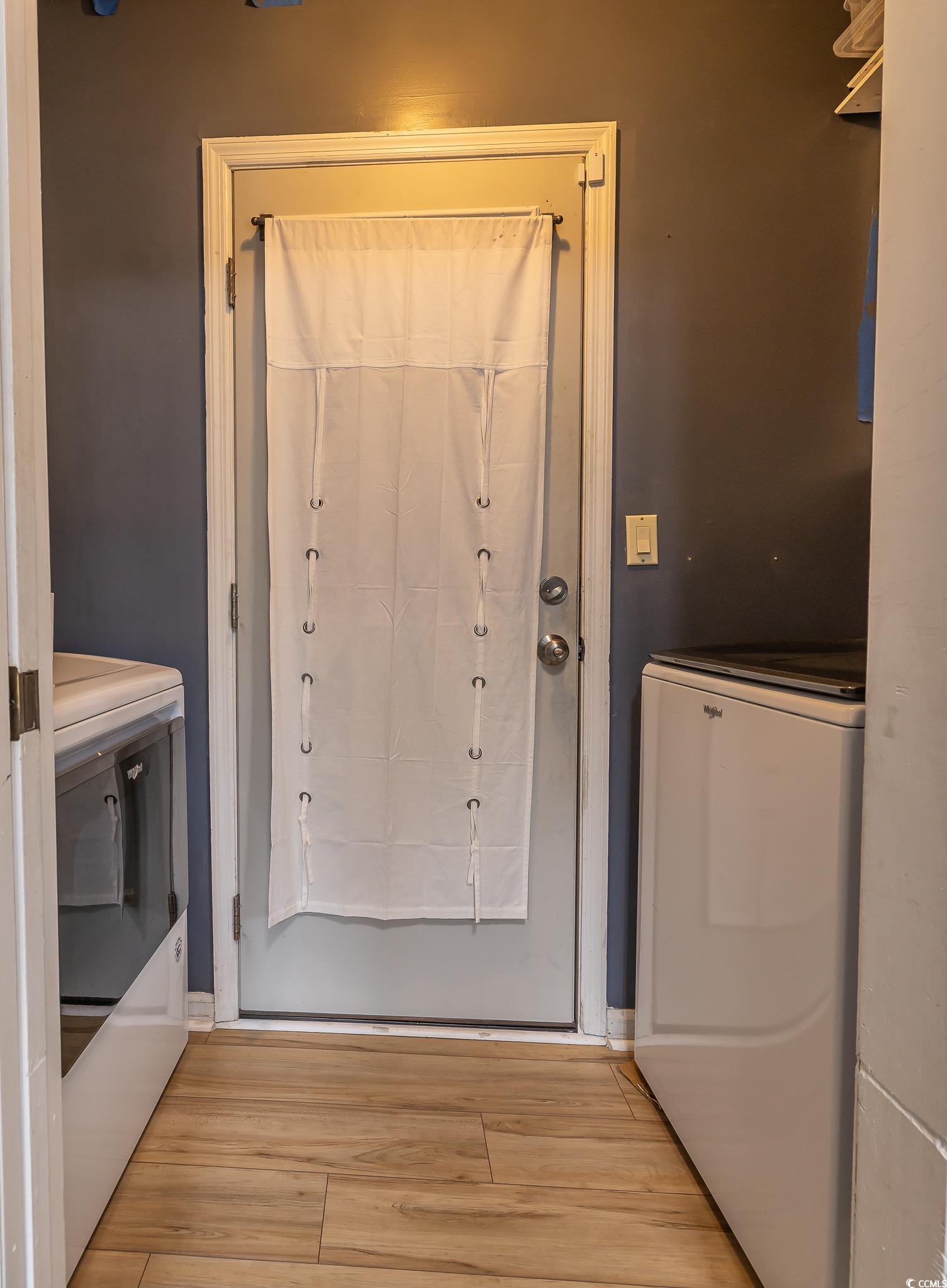 603 Hatteras River Road Myrtle Beach, SC 29588 - Photo 8 of 22 Doorway featuring washer / dryer and light hardwoo