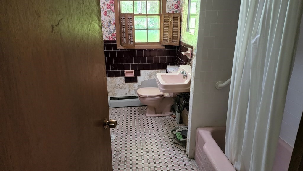 27 Janet Road Chelmsford, MA 01824 - Photo 8 of 13 a bathroom with a toilet a sink and a window
